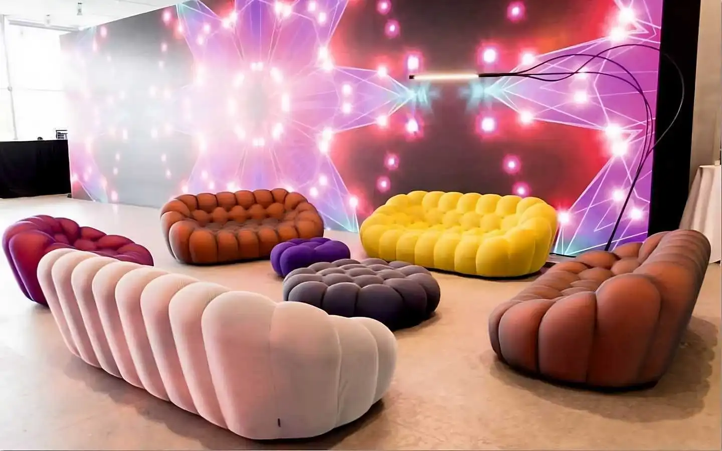 Modern luxury lounge featuring colorful Roche Bobois style bubble sofas and designer furniture in a high-end Delhi interior project