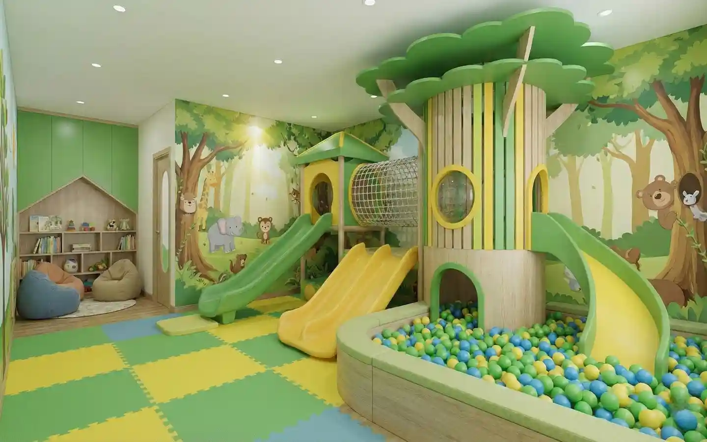 Nature-themed indoor play zone for kids featuring a tree-shaped slide structure, ball pit, forest wall murals, and soft floor mats