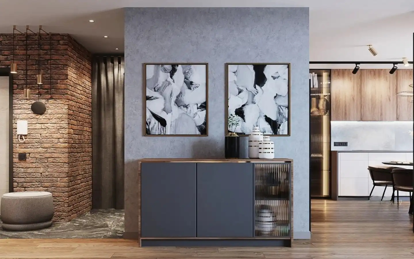 Modern entryway featuring an exposed brick accent wall, grey concrete-finish wall with abstract art, and a charcoal grey sideboard with fluted glass doors