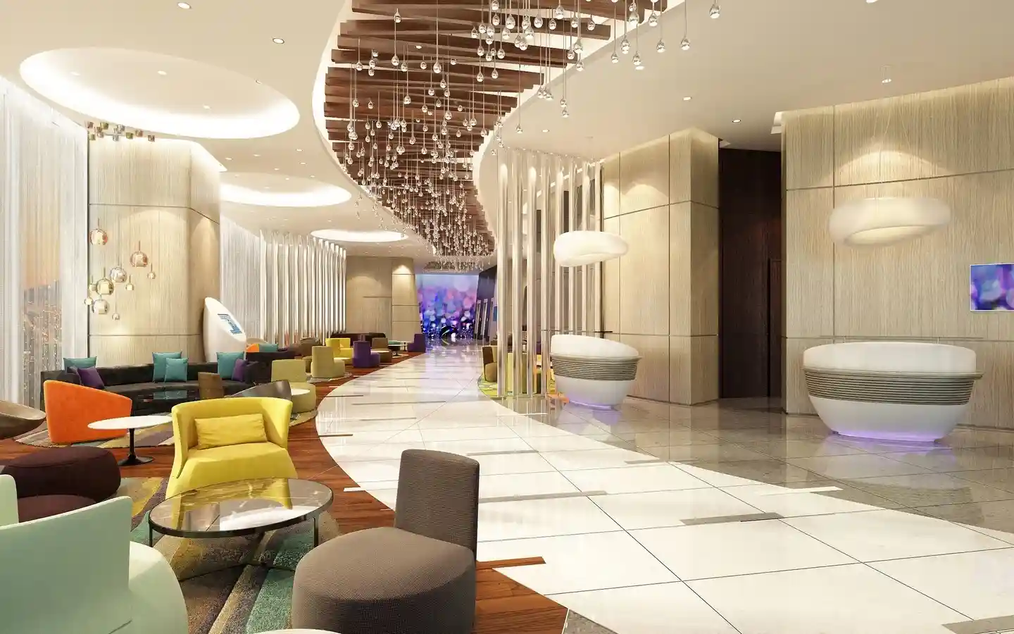 Modern hotel lobby and lounge area featuring colorful contemporary seating, curved architectural lines, and a decorative hanging light installation