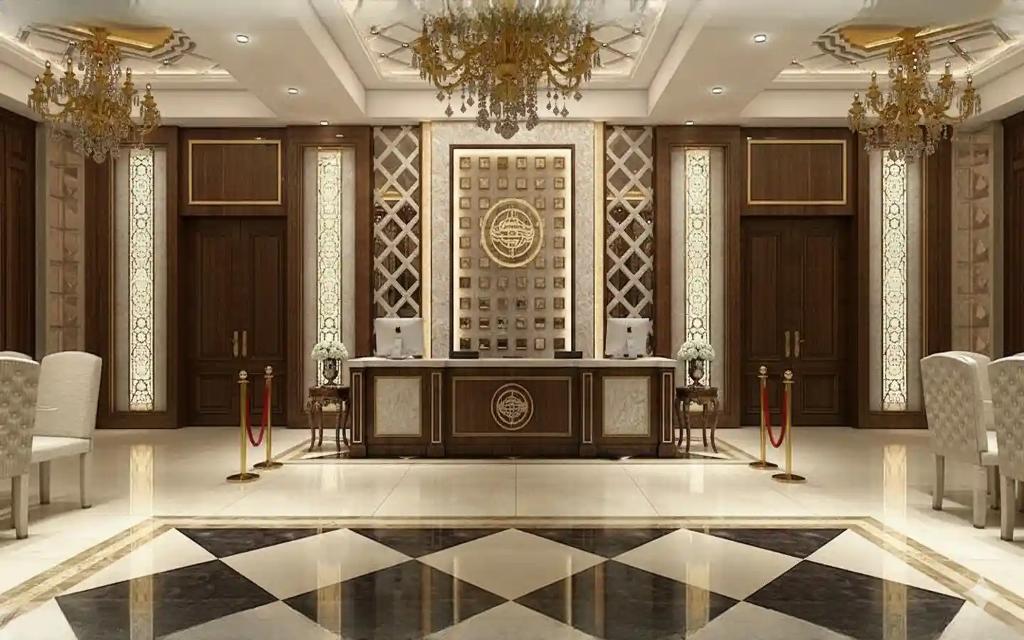 Elegant hotel reception area featuring a wood and marble front desk, ornate gold chandeliers, and geometric floor tiling