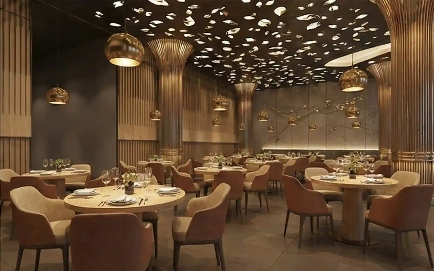 Fine dining hotel restaurant featuring gold fluted columns, ornate leaf-patterned ceiling lighting, and round wooden tables with velvet chairs