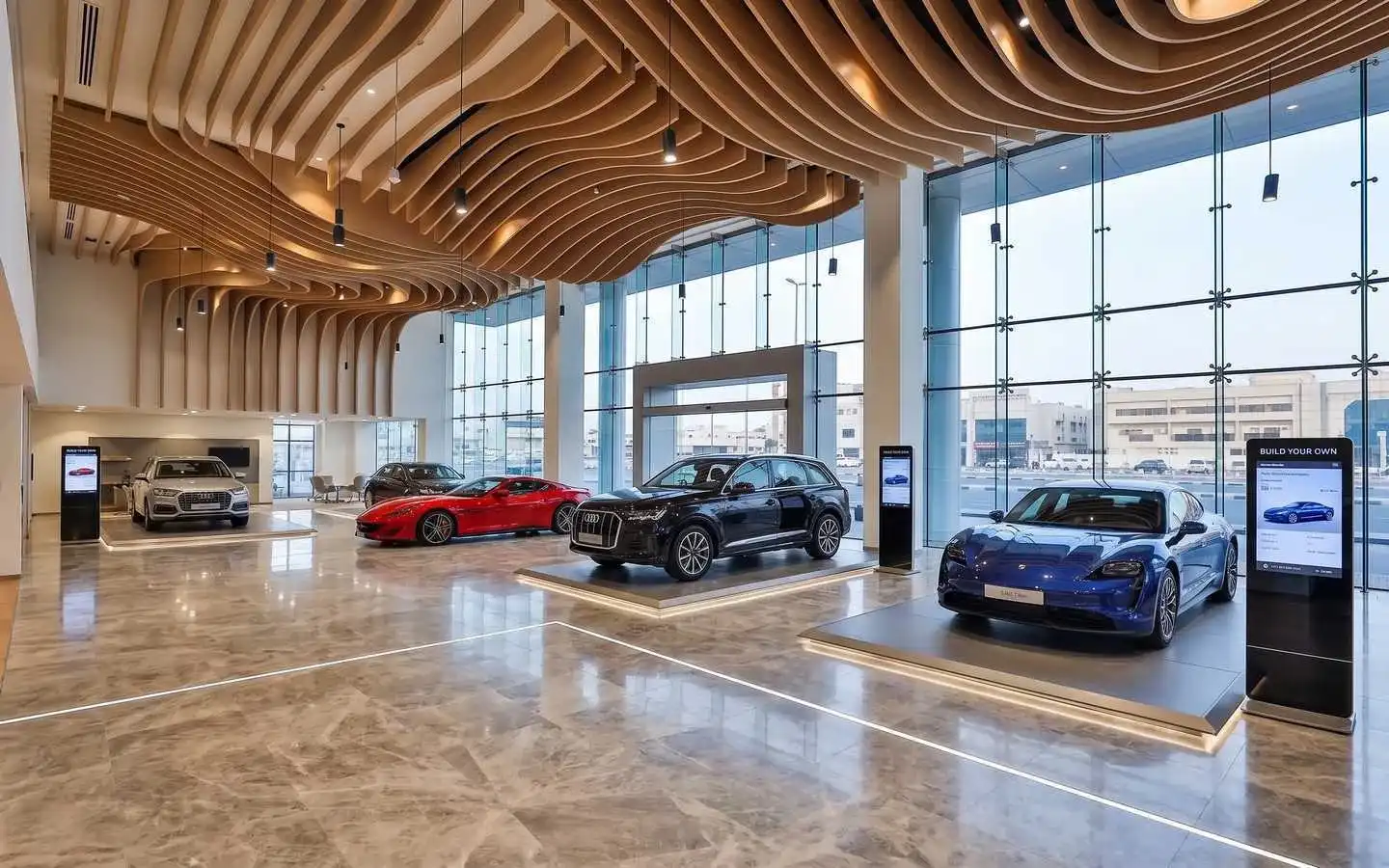 Modern luxury car showroom interior featuring a parametric wave wood ceiling, expansive glass curtain walls, and polished marble flooring with high-end vehicles on display