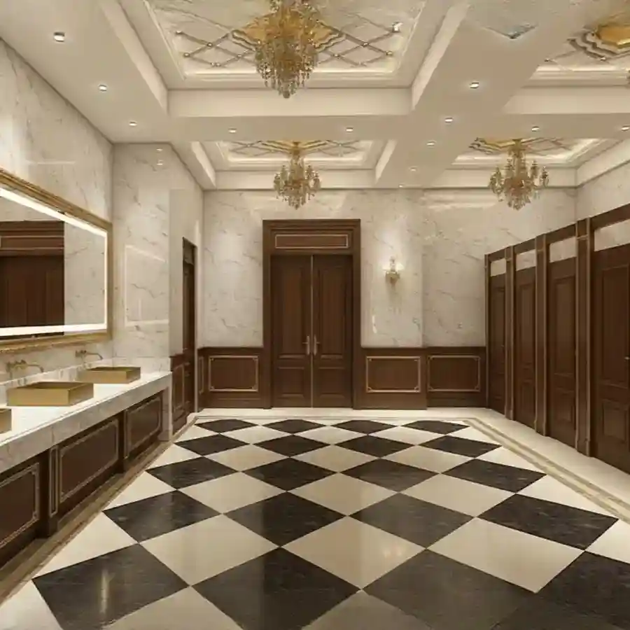 Luxury banquet hall restroom interior featuring checkered marble flooring, gold sinks, ornate chandeliers, and classic wood paneling