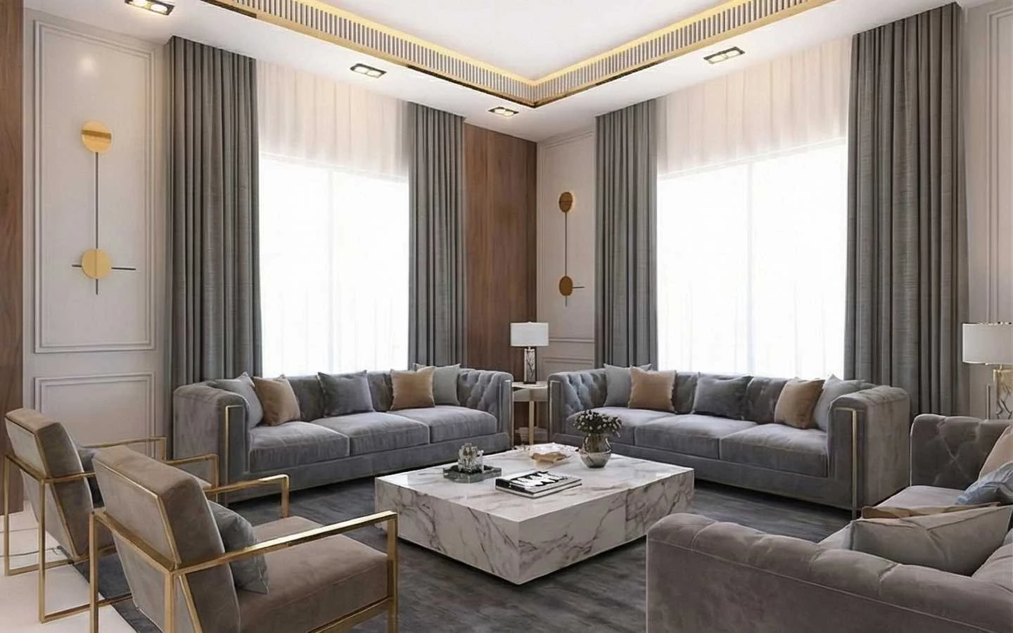 Luxury formal living room featuring a large marble block coffee table, symmetrical grey tufted velvet sofas with gold accents, floor-to-ceiling drapes, and sophisticated tray ceiling lighting