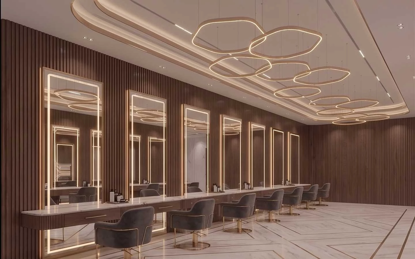 Upscale hair salon interior featuring vertical wood slat walls, long marble vanity, lighted full-length mirrors, and modern gold halo pendant lighting