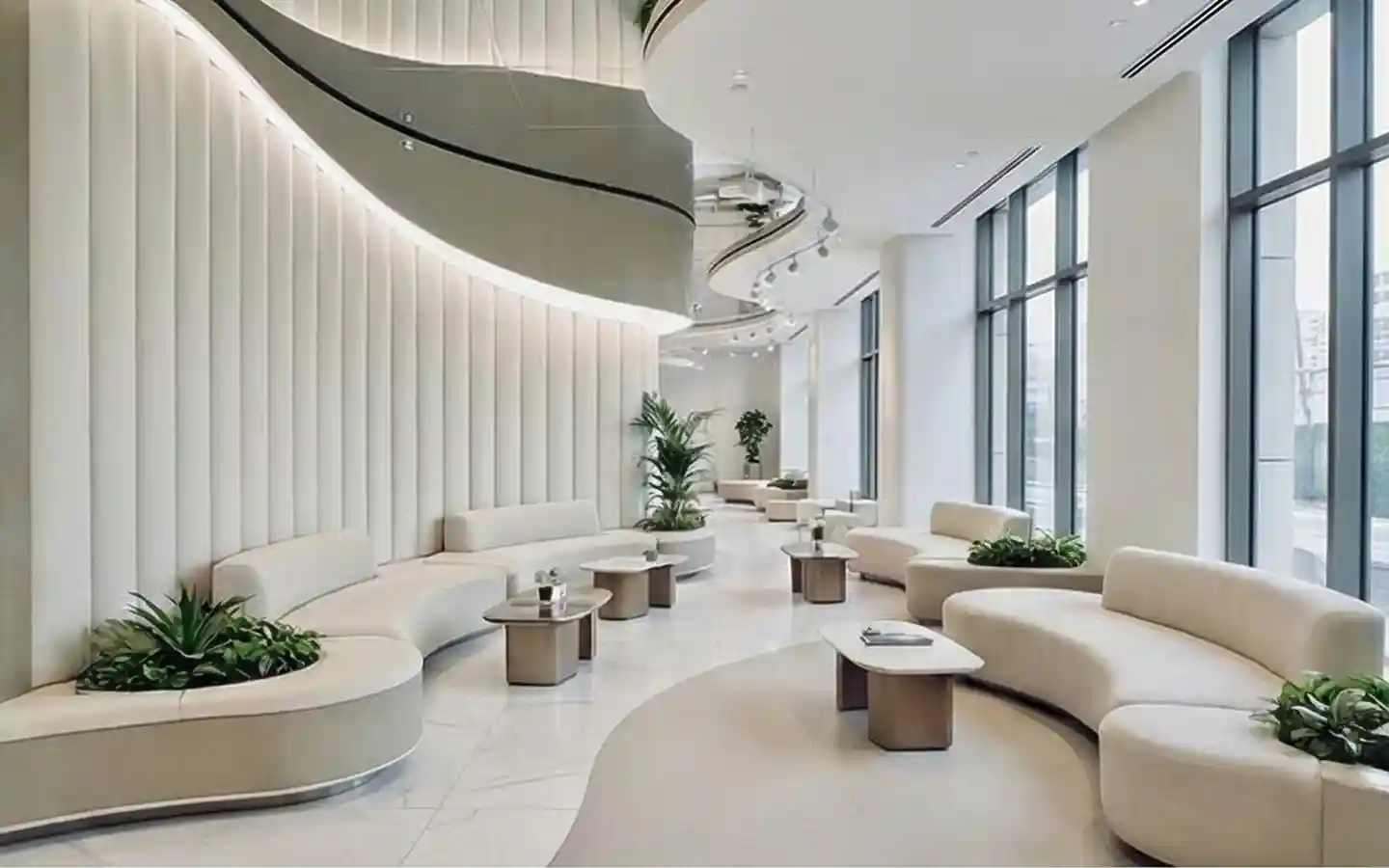 Luxury hospital lobby featuring curved white modular sofas, fluted wall panels, and indoor greenery in a bright, modern healthcare facility