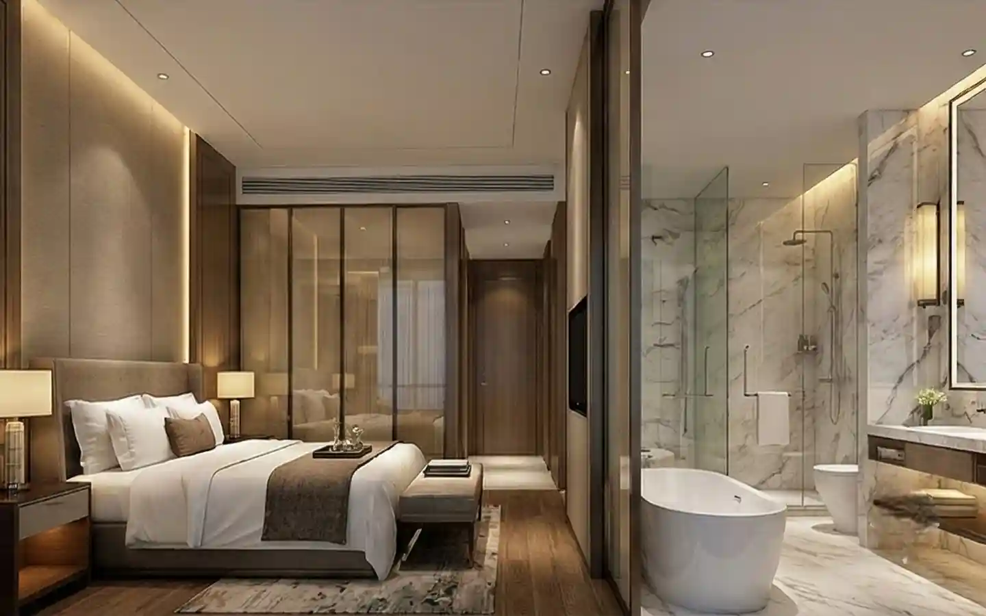 Modern luxury hotel suite interior featuring a king-size bed, glass partition, and an ensuite marble bathroom with a freestanding soaking tub