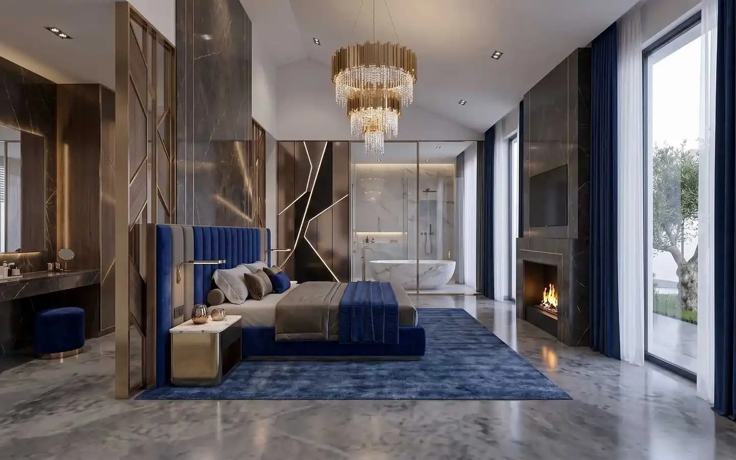 Modern luxury master bedroom with a royal blue velvet bed, marble fireplace, tiered gold chandelier, and an open ensuite bathroom with a marble tub