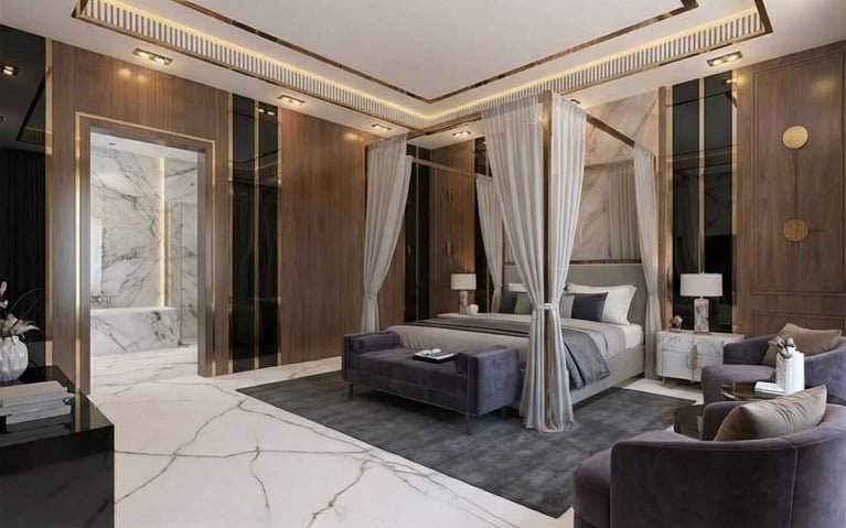 Luxury master bedroom featuring a modern canopy bed with sheer drapes, wood-paneled walls with gold accents, and a view into an integrated marble en-suite bathroom