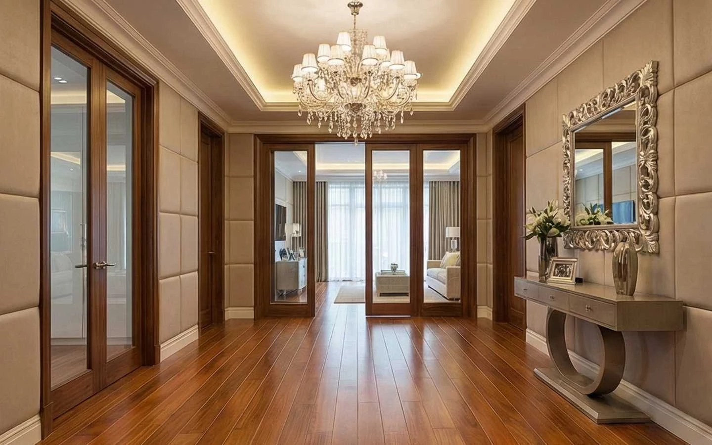 Modern luxury hallway interior featuring warm wood flooring, elegant crystal chandelier, and upholstered wall panels