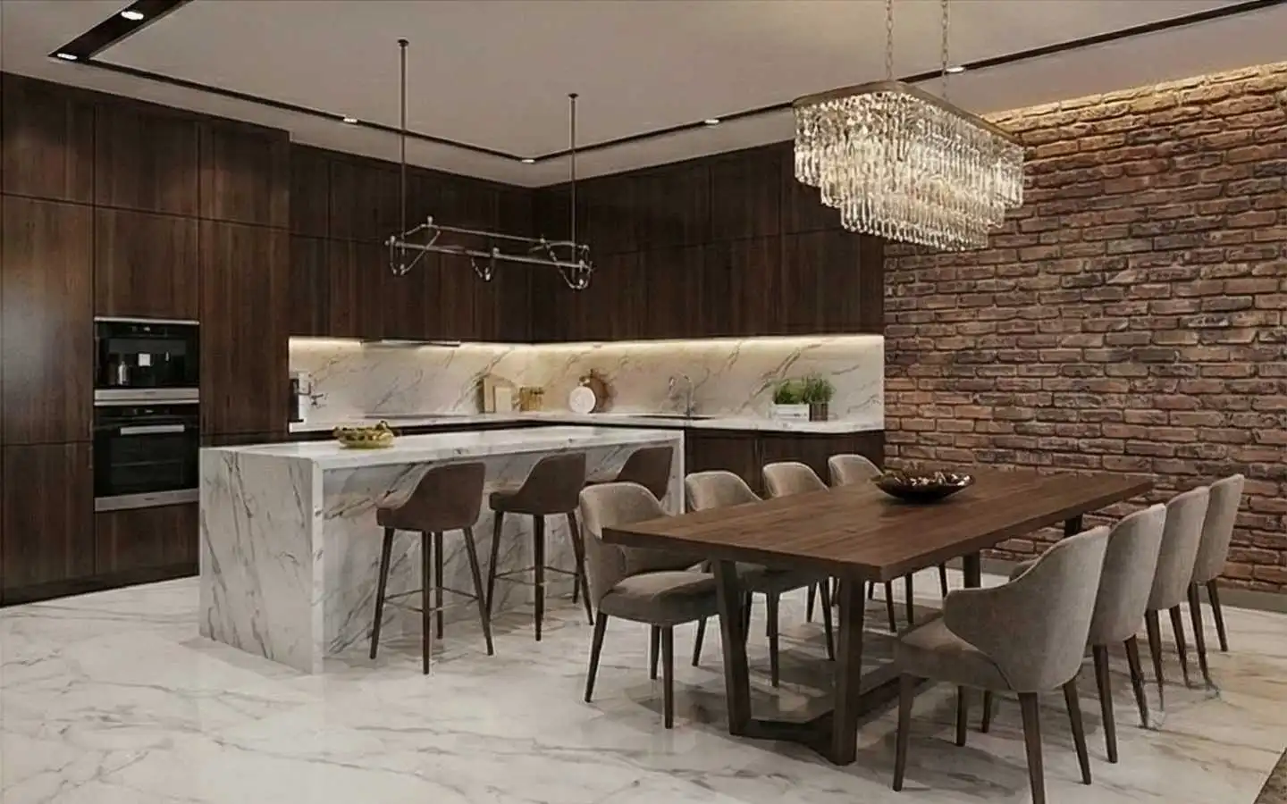 Luxury residential kitchen and dining area featuring a rustic red brick accent wall, dark wood cabinetry, a white marble waterfall island, and a crystal chandelier over a long wooden dining table