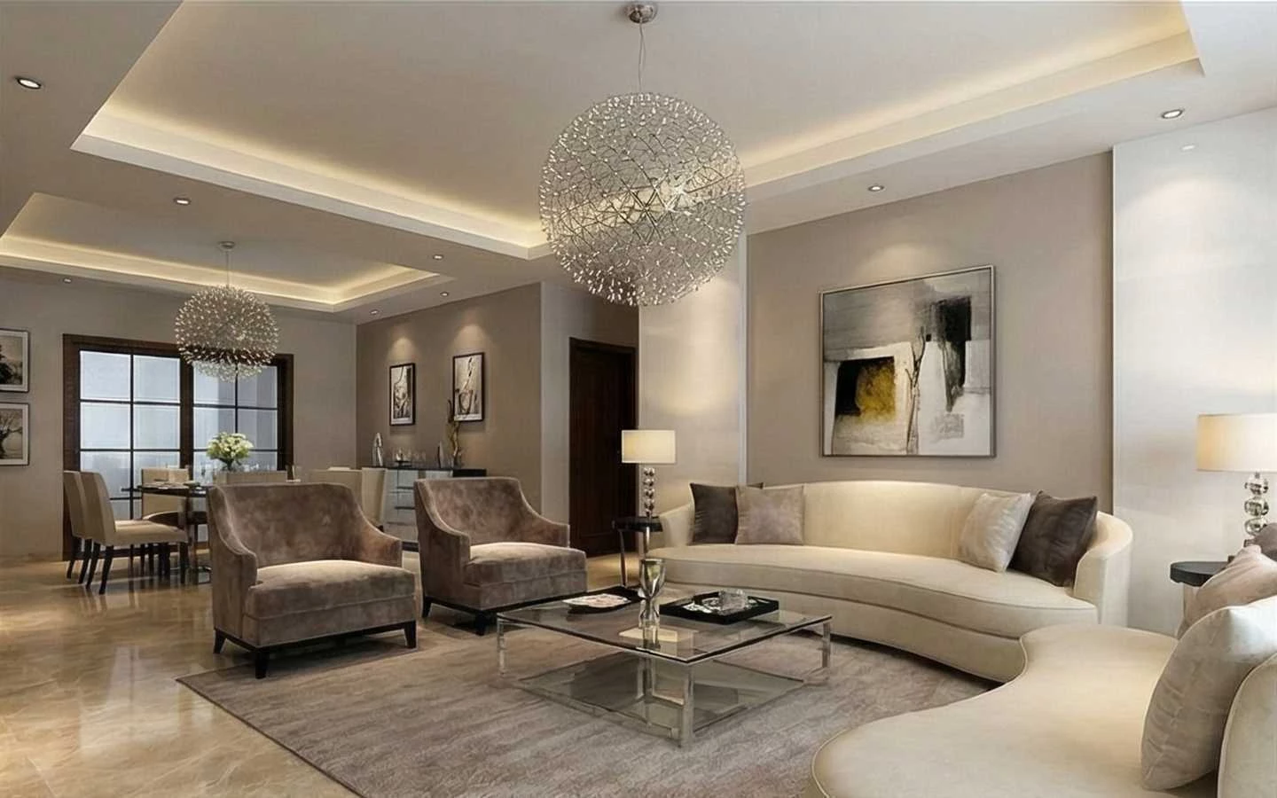 Sophisticated living room with warm neutral tones, curved cream sofas, velvet armchairs, and a large silver sparkle globe pendant light in an open-concept layout
