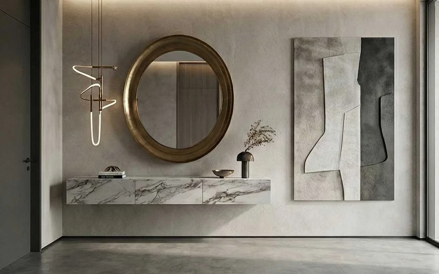 Modern minimalist foyer featuring a floating marble console table, a large circular gold mirror, and abstract wall art