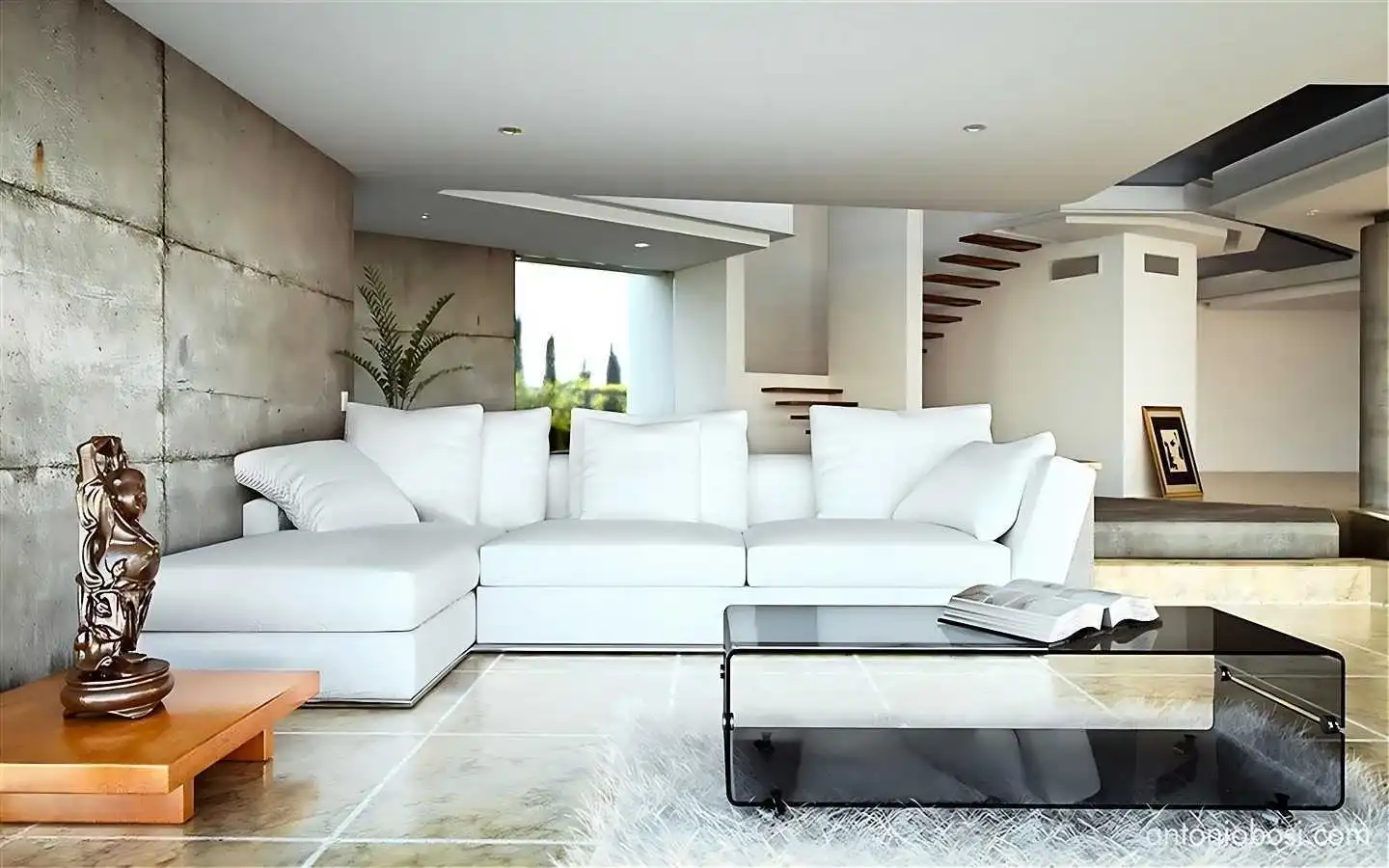 Modern living room featuring a raw concrete accent wall, a white L-shaped sectional sofa, glass coffee table, and minimalist floating stairs