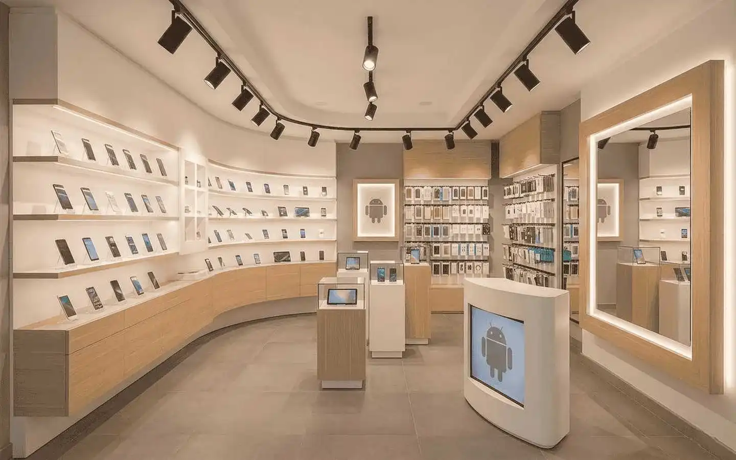 Retail mobile store interior featuring a curved backlit display wall for smartphones, wood-framed mirrors, and a branded Android digital kiosk