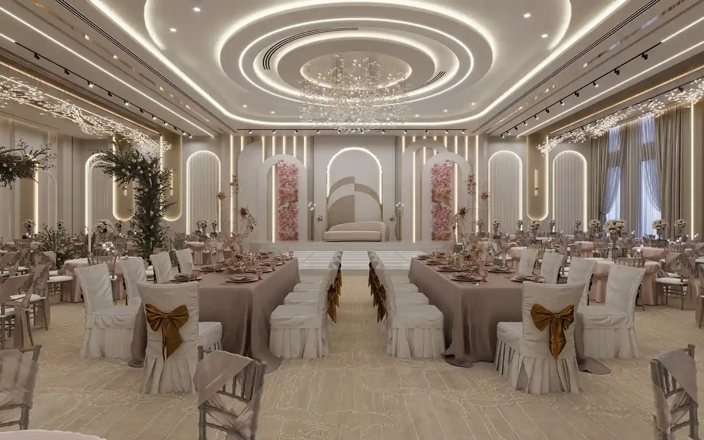 Modern banquet hall interior with a circular tray ceiling design, crystal chandelier, floral wedding stage, and elegant table settings