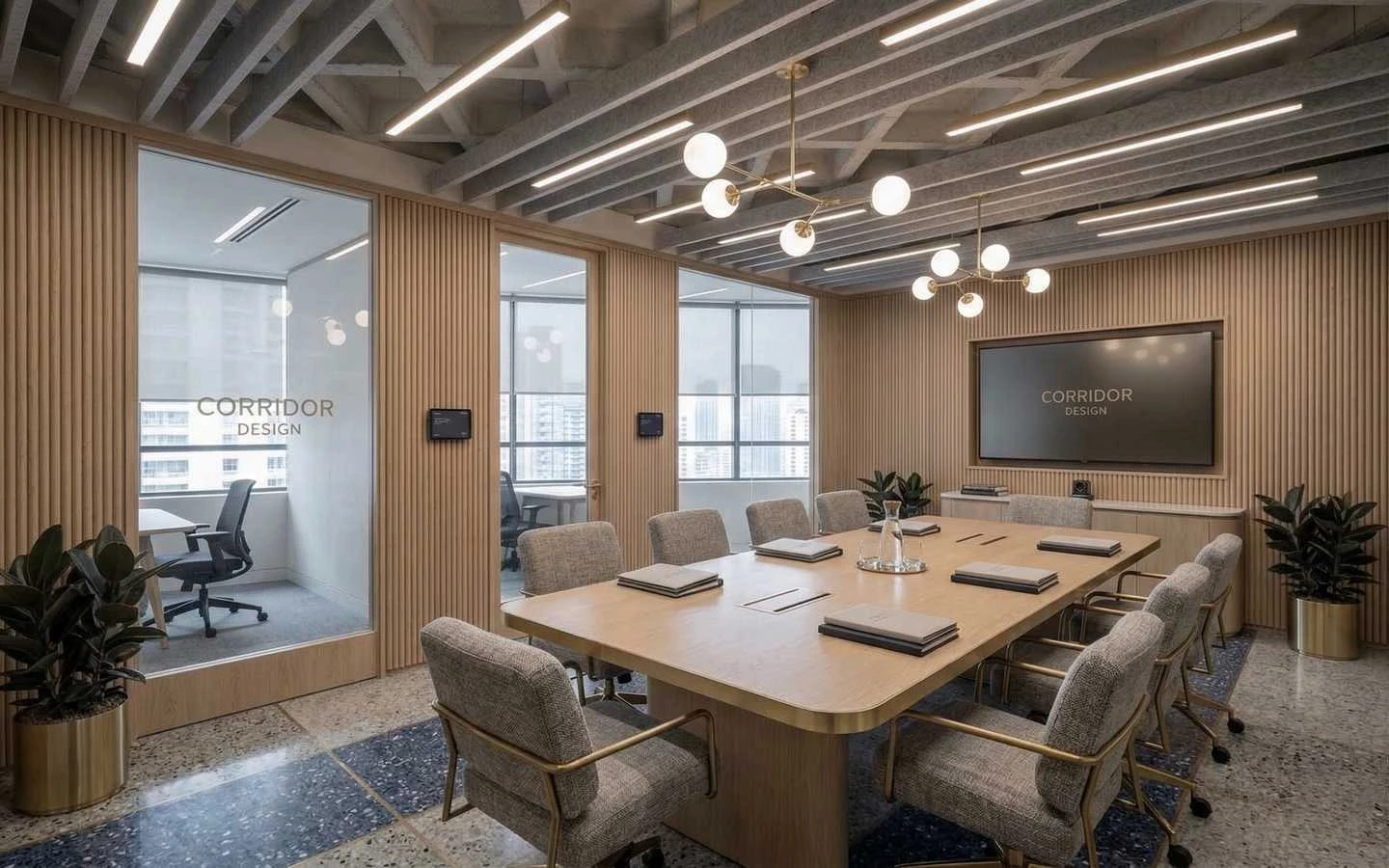 Modern corporate conference room featuring a light wood table, grey upholstered chairs, fluted wood wall paneling, and industrial ceiling lighting