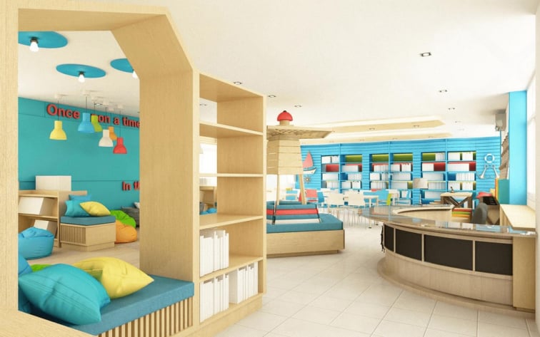 Bright modern kids’ library and classroom interior with colorful seating, bean bags, shelves with books, interactive learning areas, and blue accent walls