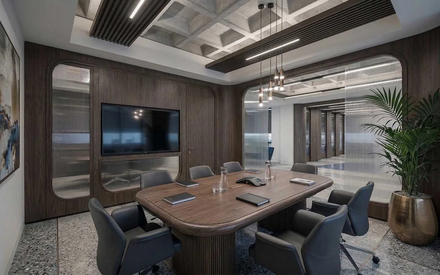 Modern luxury conference room featuring a large walnut meeting table, ergonomic black leather chairs, dark wood wall paneling with an integrated TV, and industrial fluted glass partitions