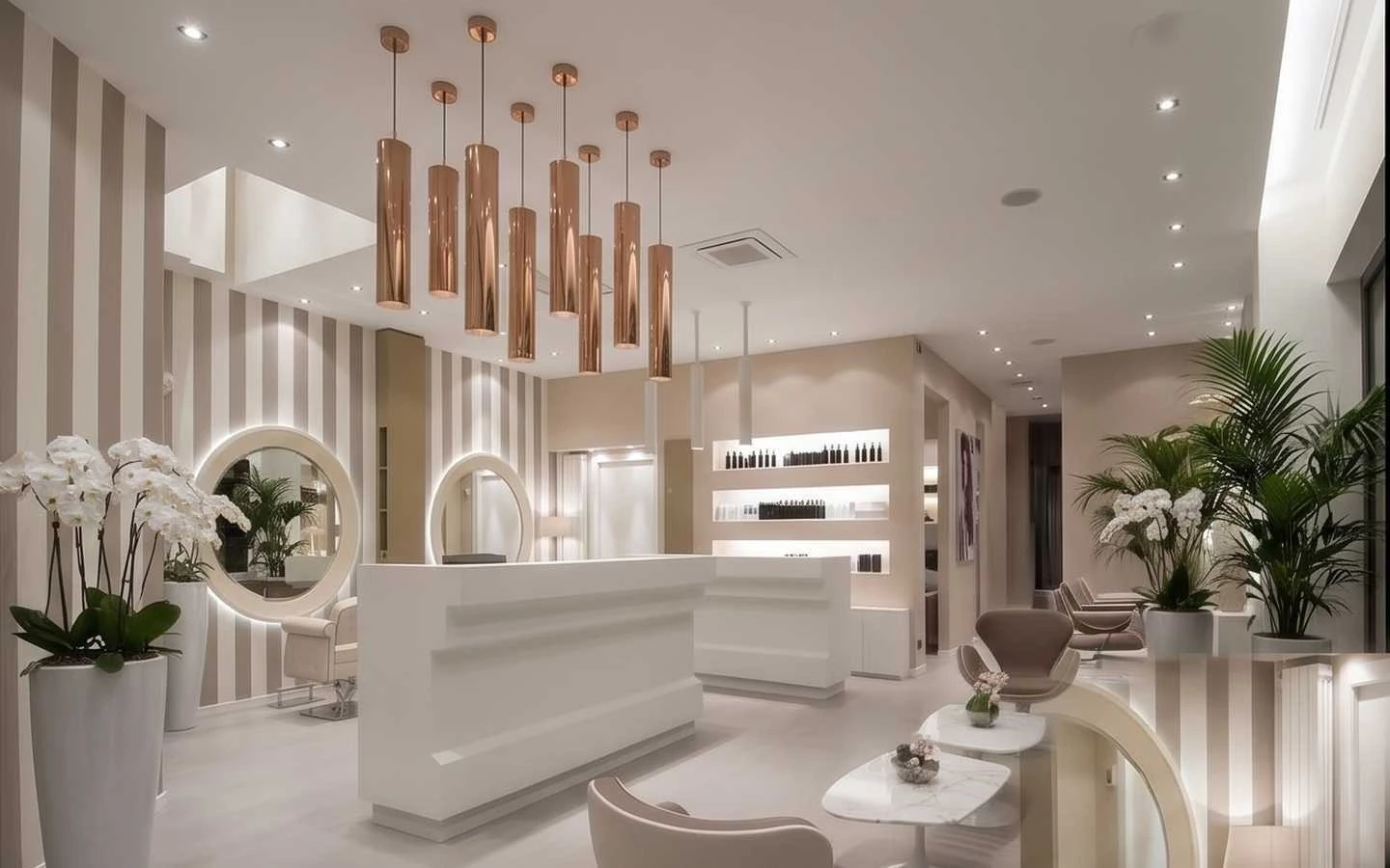 Modern luxury hair salon interior featuring a sleek white reception desk, rose gold pendant lighting, and elegant striped wallpaper design