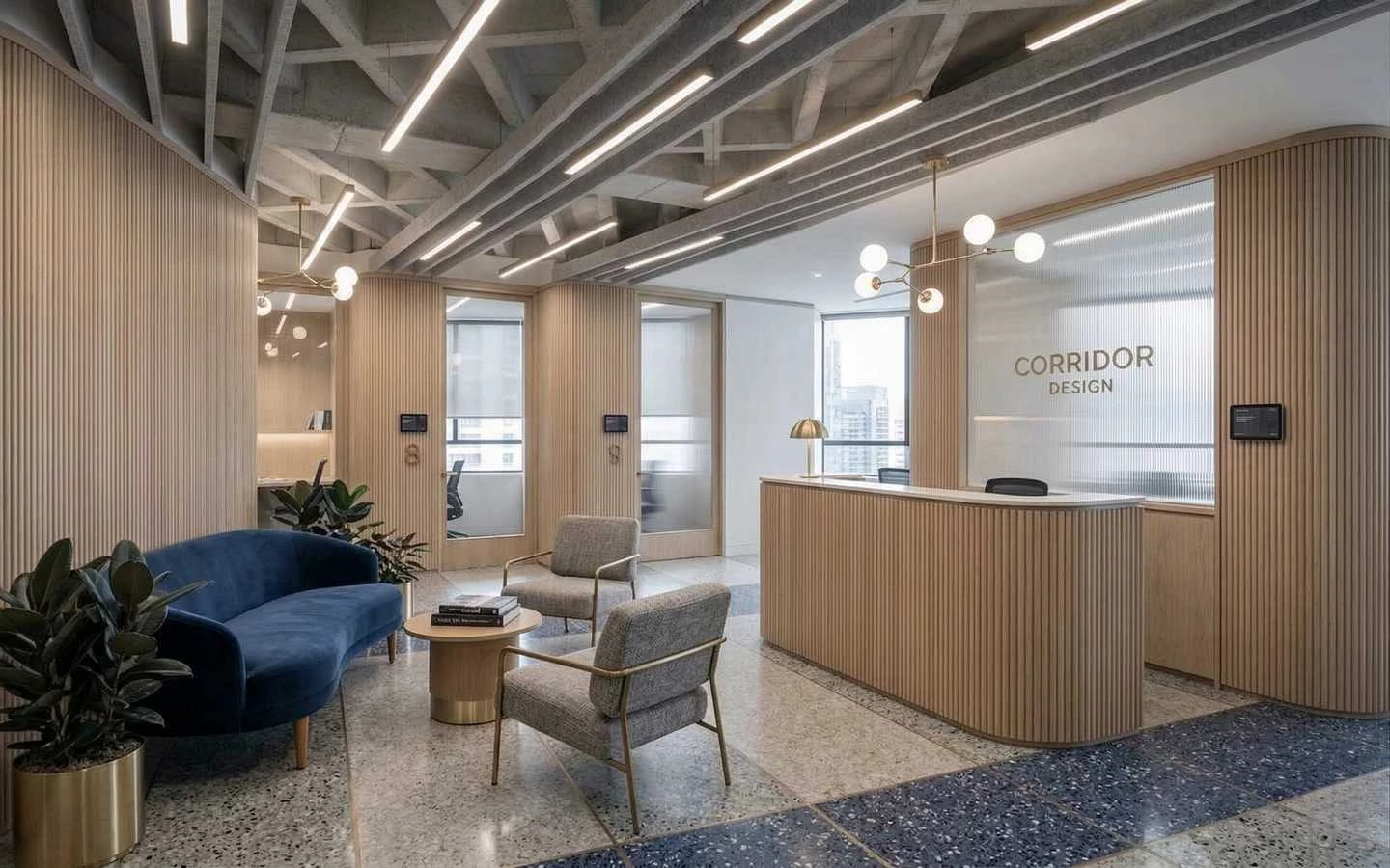 Modern office reception area featuring fluted wood wall panels, a matching curved desk, blue velvet sofa, and industrial-style exposed ceiling with linear lighting