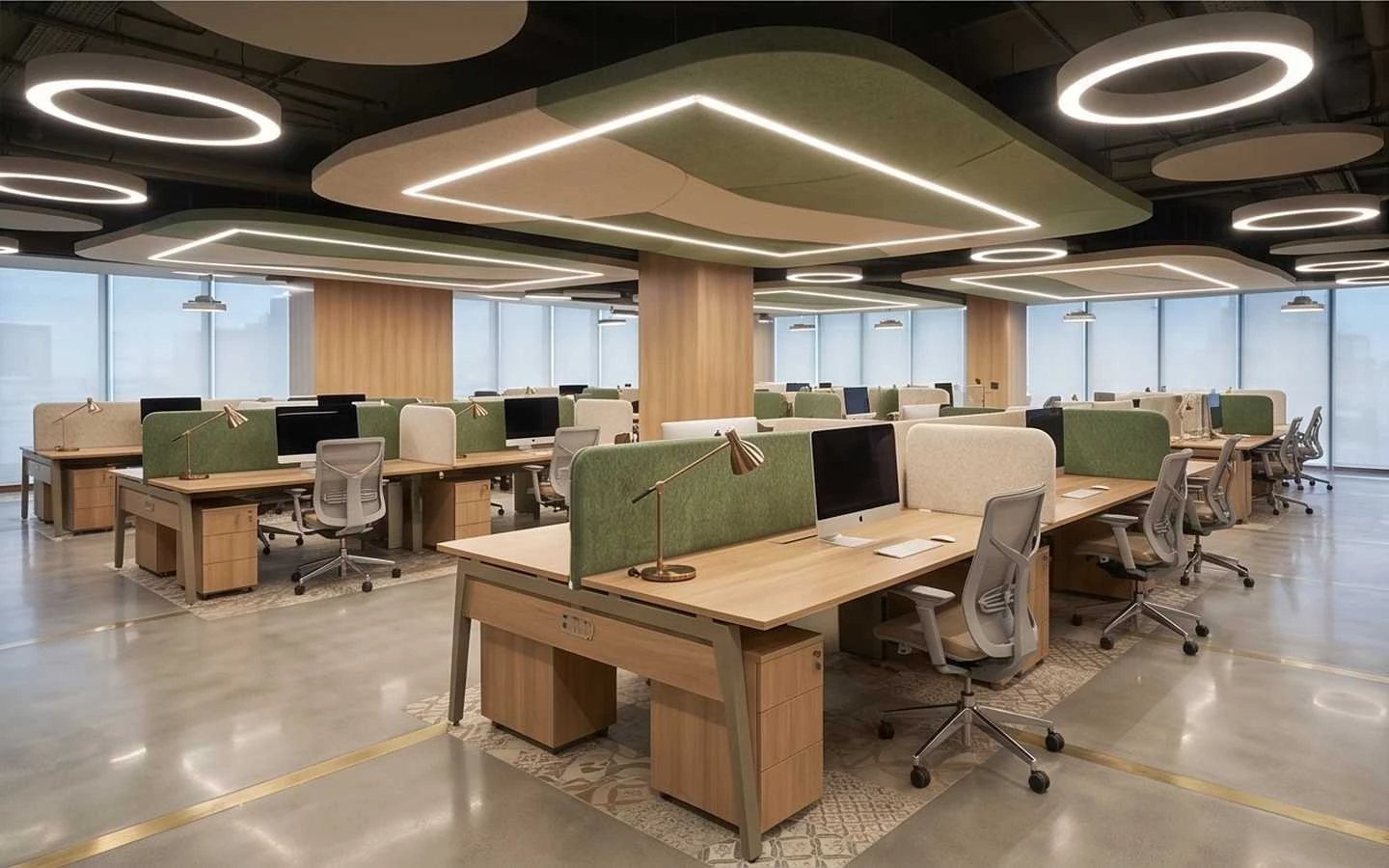 Modern open-plan office interior with wooden desks, green acoustic privacy screens, ergonomic chairs, and creative halo lighting