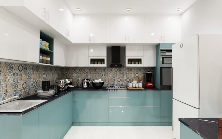 Modern U-shaped home kitchen featuring vibrant teal lower cabinets, glossy white upper cabinetry, a decorative patterned tile backsplash, and sleek black countertops