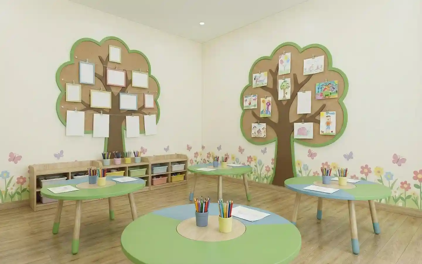 Creative preschool art room featuring tree-shaped cork bulletin boards, colorful round activity tables, and low-level toy storage shelving